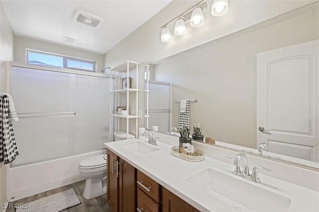 6713 Guidestar St, North Las Vegas, NV 89084 - full bathroom featuring double vanity, wood finished floors, and bathing tub / shower combination