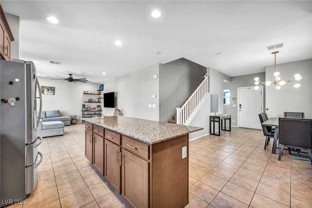 2024 Mystic Wave Rd, North Las Vegas, NV 89031 - kitchen featuring freestanding refrigerator, a ceiling fan, light tile patterned floors, recessed lighting, and open floor plan