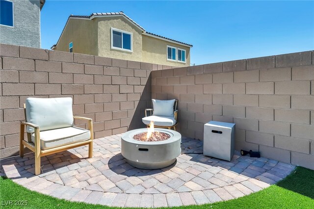 2024 Mystic Wave Rd, North Las Vegas, NV 89031 - view of patio / terrace featuring an outdoor fire pit