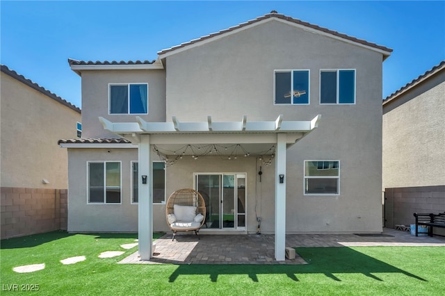 2024 Mystic Wave Rd, North Las Vegas, NV 89031 - rear view of property with stucco siding, a tiled roof, a patio area, and a pergola