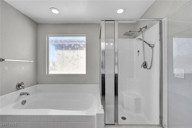 2024 Mystic Wave Rd, North Las Vegas, NV 89031 - bathroom featuring a bath and a stall shower