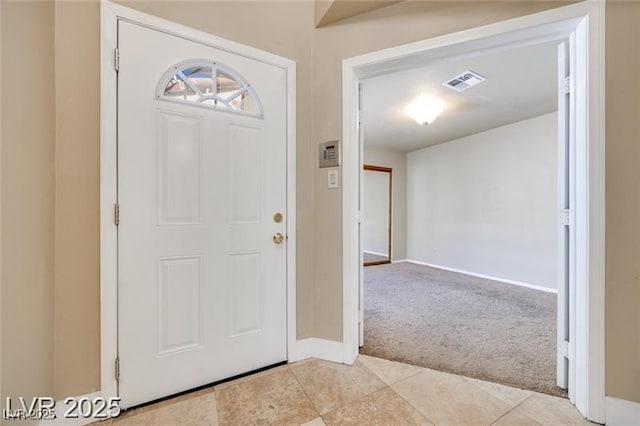 2723 Seabridge Dr, Las Vegas, NV 89121 - foyer entrance with light colored carpet and light tile patterned floors