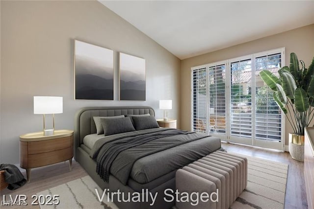 2723 Seabridge Dr, Las Vegas, NV 89121 - bedroom with wood finished floors, lofted ceiling, and access to outside
