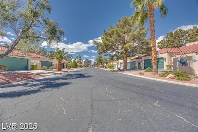 2723 Seabridge Dr, Las Vegas, NV 89121 - view of asphalt road featuring curbs
