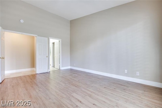 2723 Seabridge Dr, Las Vegas, NV 89121 - spare room featuring wood finished floors and baseboards