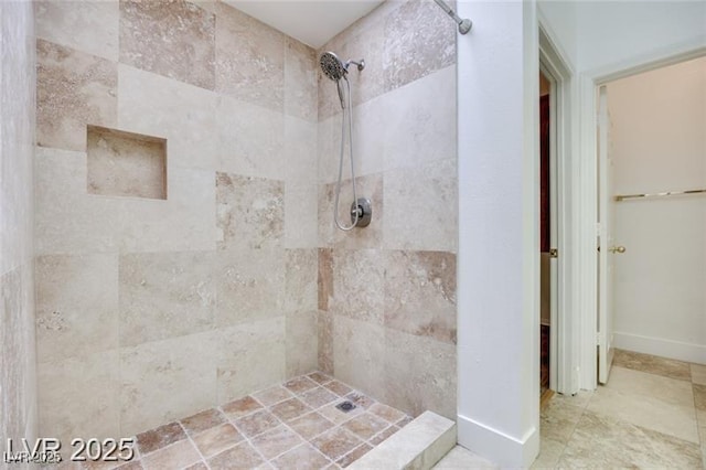 2723 Seabridge Dr, Las Vegas, NV 89121 - bathroom featuring a tile shower and baseboards