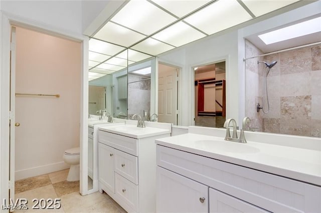 2723 Seabridge Dr, Las Vegas, NV 89121 - bathroom with tiled shower, two vanities, and a closet