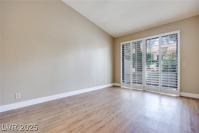 2723 Seabridge Dr, Las Vegas, NV 89121 - unfurnished room featuring vaulted ceiling and wood finished floors
