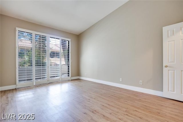 2723 Seabridge Dr, Las Vegas, NV 89121 - unfurnished room with wood finished floors and vaulted ceiling
