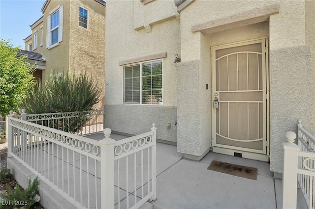7640 Woven Memories St, Las Vegas, NV 89149 - doorway to property with stucco siding