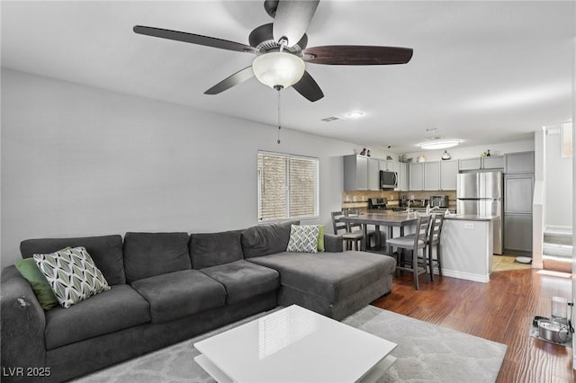 7640 Woven Memories St, Las Vegas, NV 89149 - living area featuring wood finished floors and ceiling fan