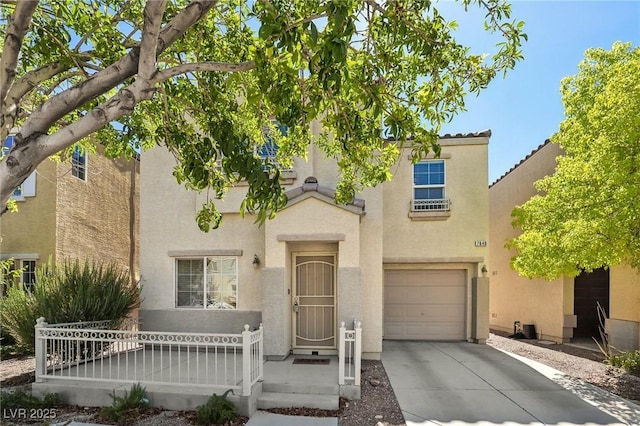 7640 Woven Memories St, Las Vegas, NV 89149 - view of front of home with driveway, stucco siding, and an attached garage