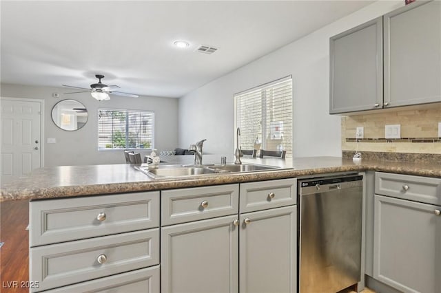 7640 Woven Memories St, Las Vegas, NV 89149 - kitchen featuring dishwasher, ceiling fan, a peninsula, backsplash, and gray cabinetry