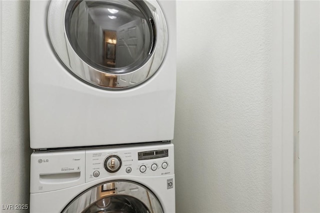 7640 Woven Memories St, Las Vegas, NV 89149 - laundry area featuring estacked washer and dryer and a textured wall