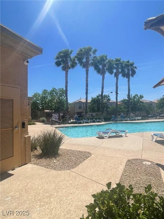 7640 Woven Memories St, Las Vegas, NV 89149 - community pool featuring a patio and a water slide