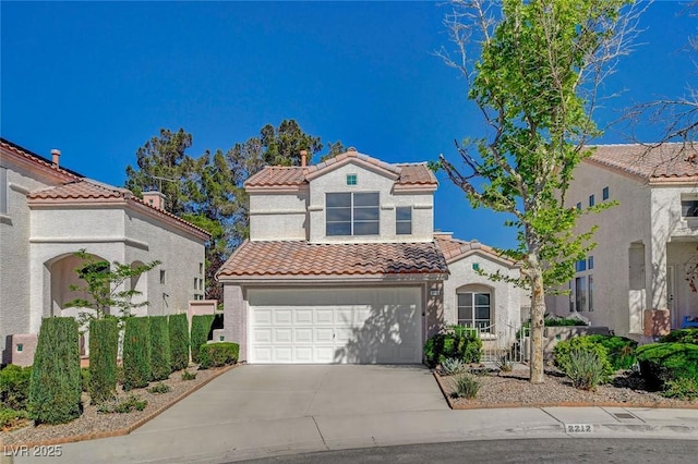 2212 Warm Walnut Dr, Las Vegas, NV 89134 - mediterranean / spanish house with a tiled roof, driveway, a garage, and stucco siding