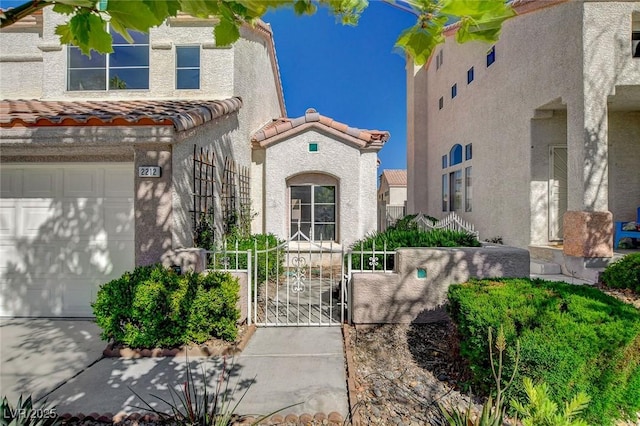 2212 Warm Walnut Dr, Las Vegas, NV 89134 - view of front of home featuring a tile roof, a gate, stucco siding, and a garage