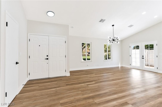 811 Spyglass Ln, Las Vegas, NV 89107 - foyer with light wood finished floors, a chandelier, french doors, and vaulted ceiling