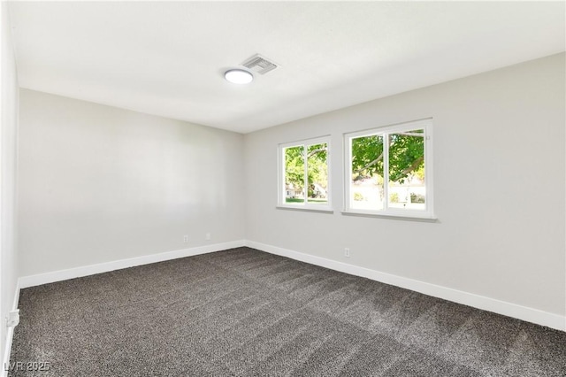 811 Spyglass Ln, Las Vegas, NV 89107 - empty room featuring baseboards and dark colored carpet