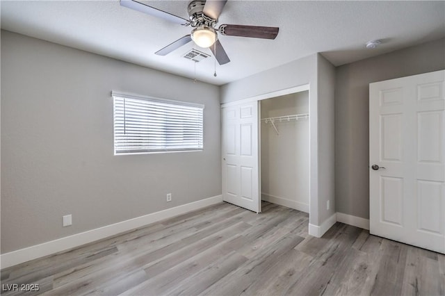 9129 Patrick Henry Ave, Las Vegas, NV 89149 - unfurnished bedroom featuring light wood-type flooring, a closet, and a ceiling fan