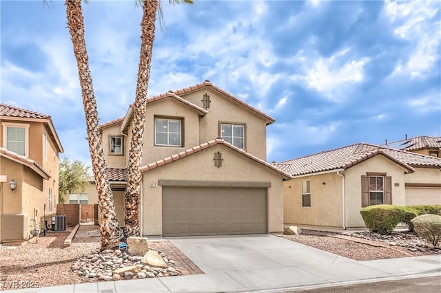 9129 Patrick Henry Ave, Las Vegas, NV 89149 - mediterranean / spanish home with a tile roof, stucco siding, concrete driveway, and a garage