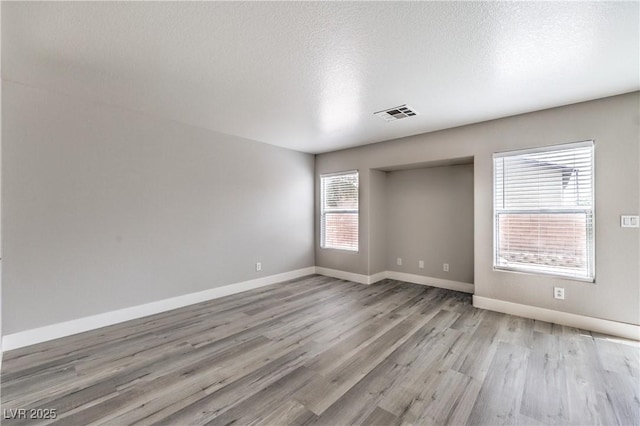 9129 Patrick Henry Ave, Las Vegas, NV 89149 - unfurnished room featuring wood finished floors and a textured ceiling