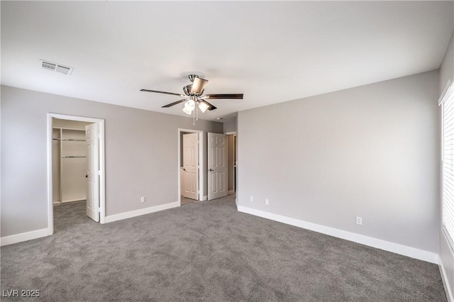 9129 Patrick Henry Ave, Las Vegas, NV 89149 - unfurnished bedroom featuring a spacious closet, carpet, ceiling fan, and a closet