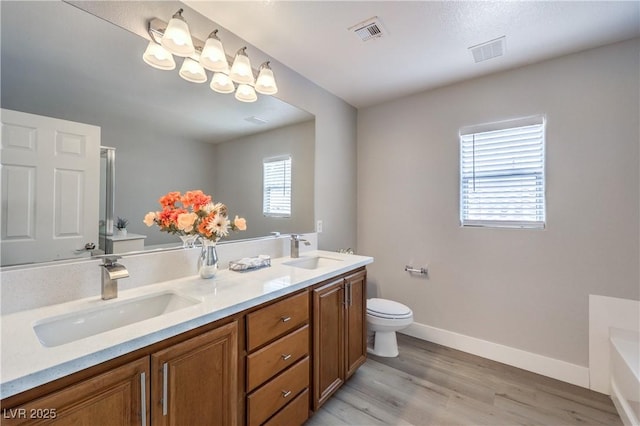9129 Patrick Henry Ave, Las Vegas, NV 89149 - full bathroom with a bath, double vanity, and wood finished floors