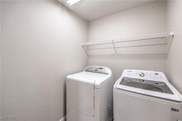 9129 Patrick Henry Ave, Las Vegas, NV 89149 - washroom with independent washer and dryer and a textured wall
