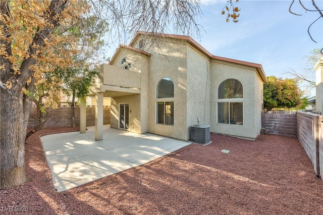 8113 Bay Springs Dr, Las Vegas, NV 89128 - back of property with stucco siding, a fenced backyard, and a patio