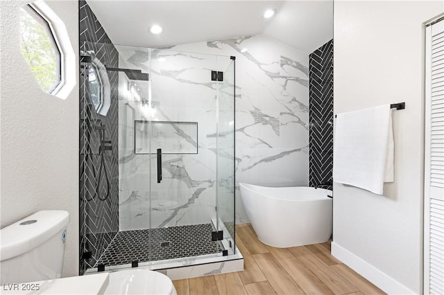 8113 Bay Springs Dr, Las Vegas, NV 89128 - bathroom with a marble finish shower, wood finished floors, a freestanding tub, and recessed lighting