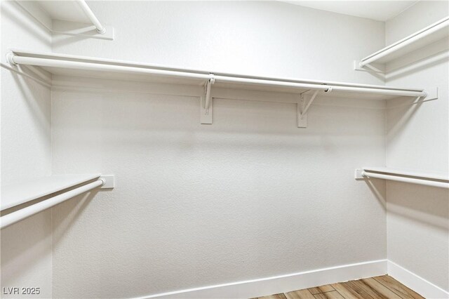 8113 Bay Springs Dr, Las Vegas, NV 89128 - walk in closet featuring light wood-style flooring