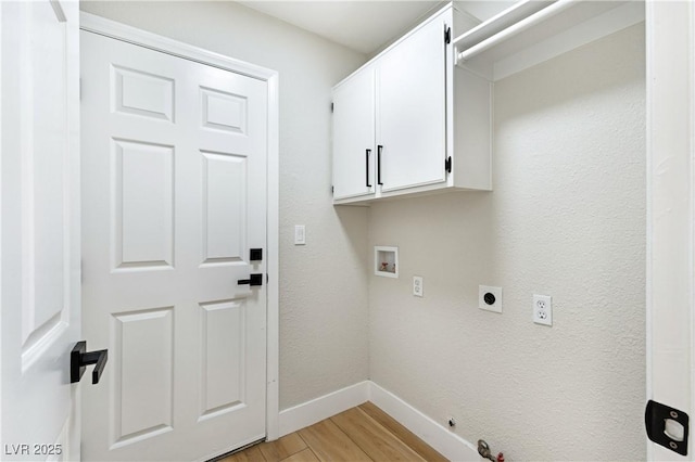 8113 Bay Springs Dr, Las Vegas, NV 89128 - laundry area with light wood finished floors, washer hookup, hookup for an electric dryer, cabinet space, and hookup for a gas dryer