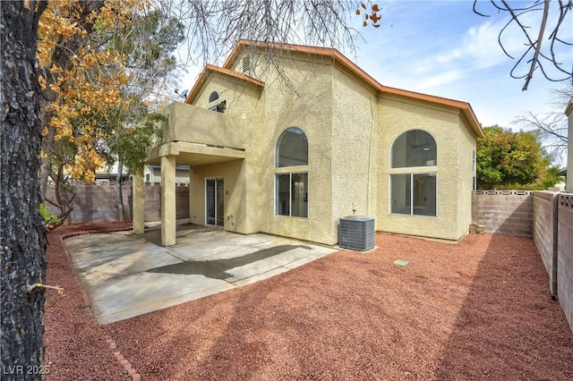 8113 Bay Springs Dr, Las Vegas, NV 89128 - back of property featuring stucco siding, a fenced backyard, a patio area, and a balcony