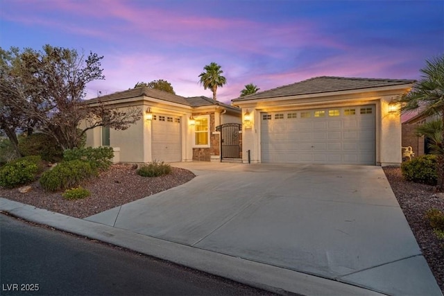 8623 Kennedy Heights Ct, Las Vegas, NV 89131 - ranch-style home with stucco siding, a garage, concrete driveway, and a gate