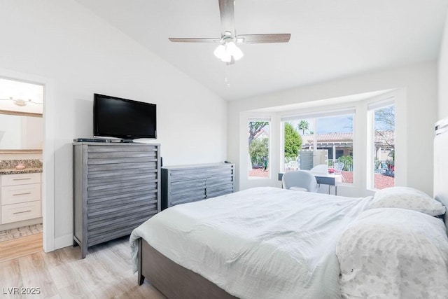 8812 Marble Dr, Las Vegas, NV 89134 - bedroom featuring vaulted ceiling, light wood-style floors, a ceiling fan, and ensuite bathroom