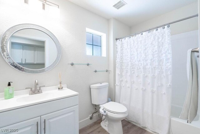 8812 Marble Dr, Las Vegas, NV 89134 - bathroom featuring wood finished floors, vanity, and shower / bathtub combination with curtain