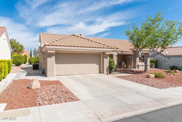 8812 Marble Dr, Las Vegas, NV 89134 - mediterranean / spanish house with a tile roof, stucco siding, and a garage