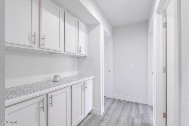 8812 Marble Dr, Las Vegas, NV 89134 - corridor featuring light wood-style floors and baseboards