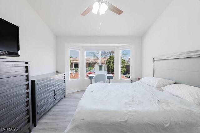 8812 Marble Dr, Las Vegas, NV 89134 - bedroom with light wood-type flooring, a ceiling fan, and lofted ceiling