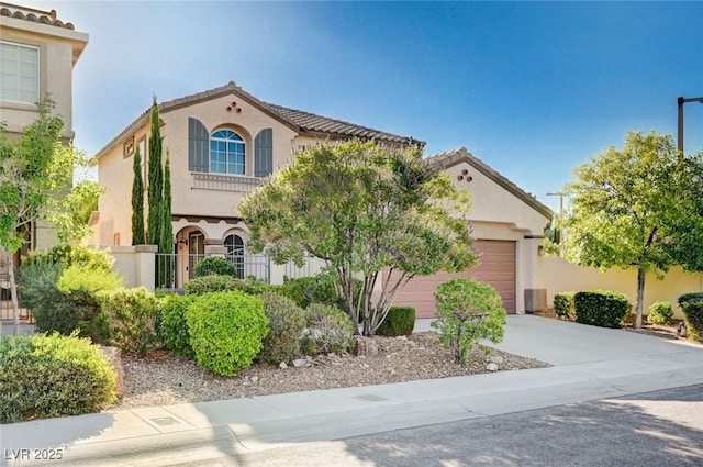 1013 Brinkman St, Las Vegas, NV 89138 - mediterranean / spanish home with an attached garage, stucco siding, concrete driveway, and a tile roof