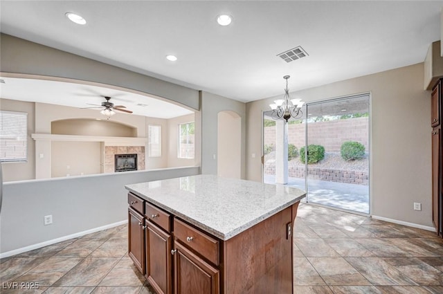 1013 Brinkman St, Las Vegas, NV 89138 - kitchen featuring ceiling fan, arched walkways, a fireplace, healthy amount of natural light, and recessed lighting