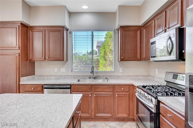 1013 Brinkman St, Las Vegas, NV 89138 - kitchen featuring stainless steel appliances, light countertops, and brown cabinetry