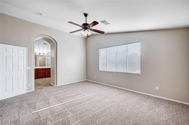 1013 Brinkman St, Las Vegas, NV 89138 - carpeted empty room with ceiling fan, arched walkways, and a smoke detector