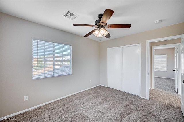 1013 Brinkman St, Las Vegas, NV 89138 - unfurnished bedroom with carpet, multiple windows, a closet, and ceiling fan