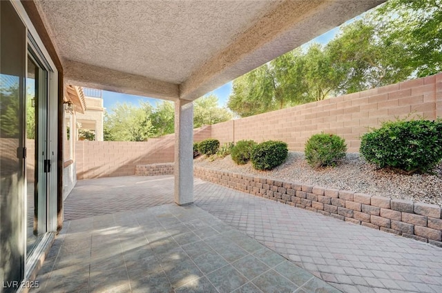 1013 Brinkman St, Las Vegas, NV 89138 - fenced backyard with a patio area