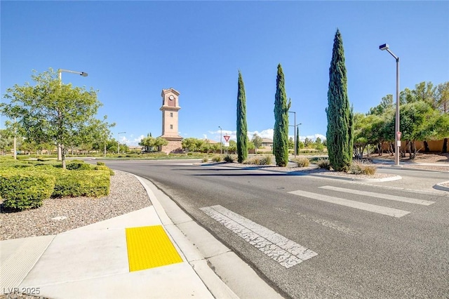 1013 Brinkman St, Las Vegas, NV 89138 - view of asphalt road featuring sidewalks, street lighting, and curbs