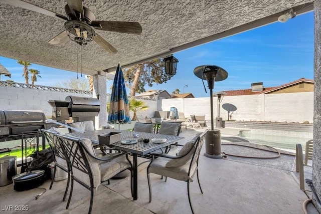 7026 Westpark Ct, Las Vegas, NV 89147 - fenced backyard with outdoor dining space, ceiling fan, and a patio