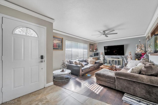 7026 Westpark Ct, Las Vegas, NV 89147 - living area with ornamental molding, a textured ceiling, and ceiling fan
