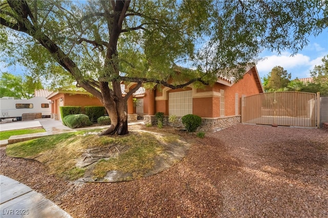 7517 Elk Meadows Ct, Las Vegas, NV 89131 - view of front of home featuring a gate, stucco siding, and a tile roof